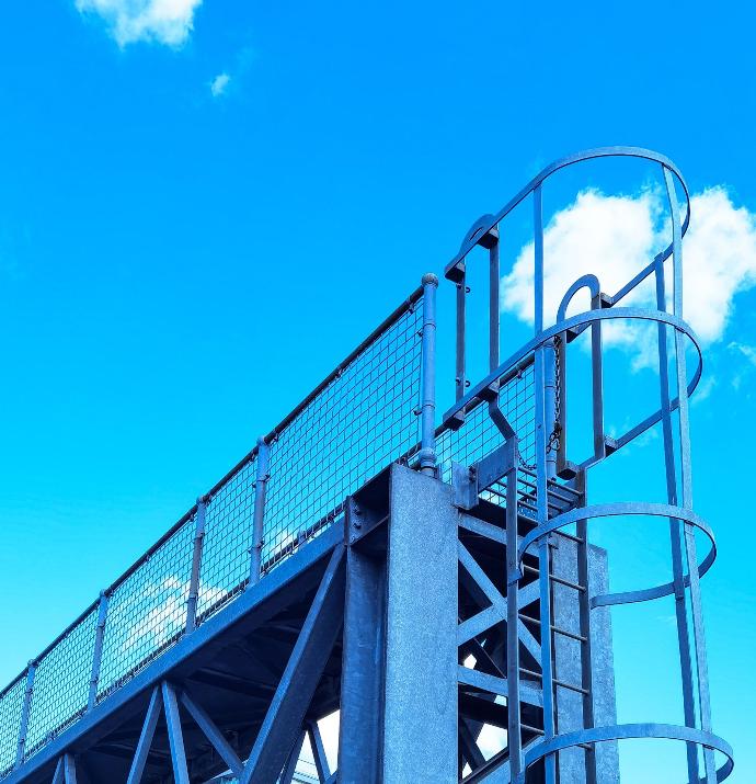 stainless steel railings on blue sky during daytime